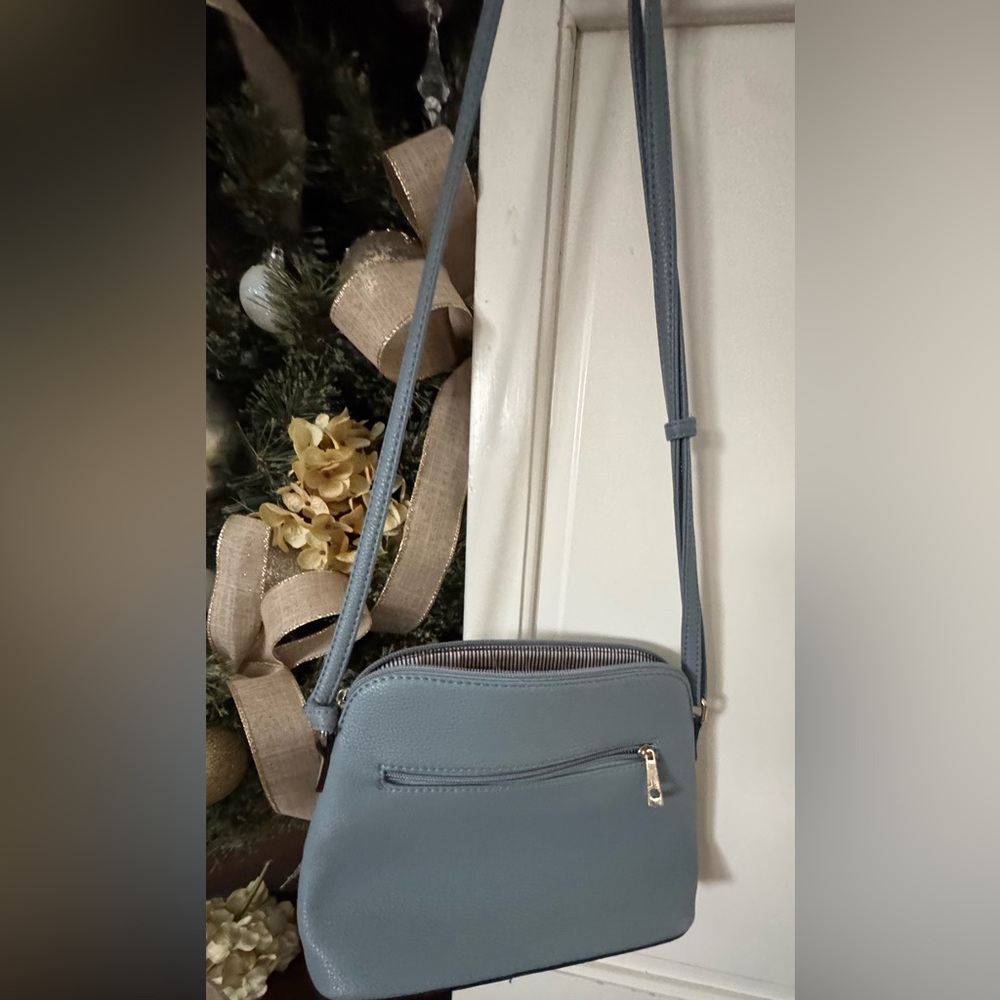 Elegant Blue Crossbody Bag with leopard lining and tassle zippers - Picture 2 of 2